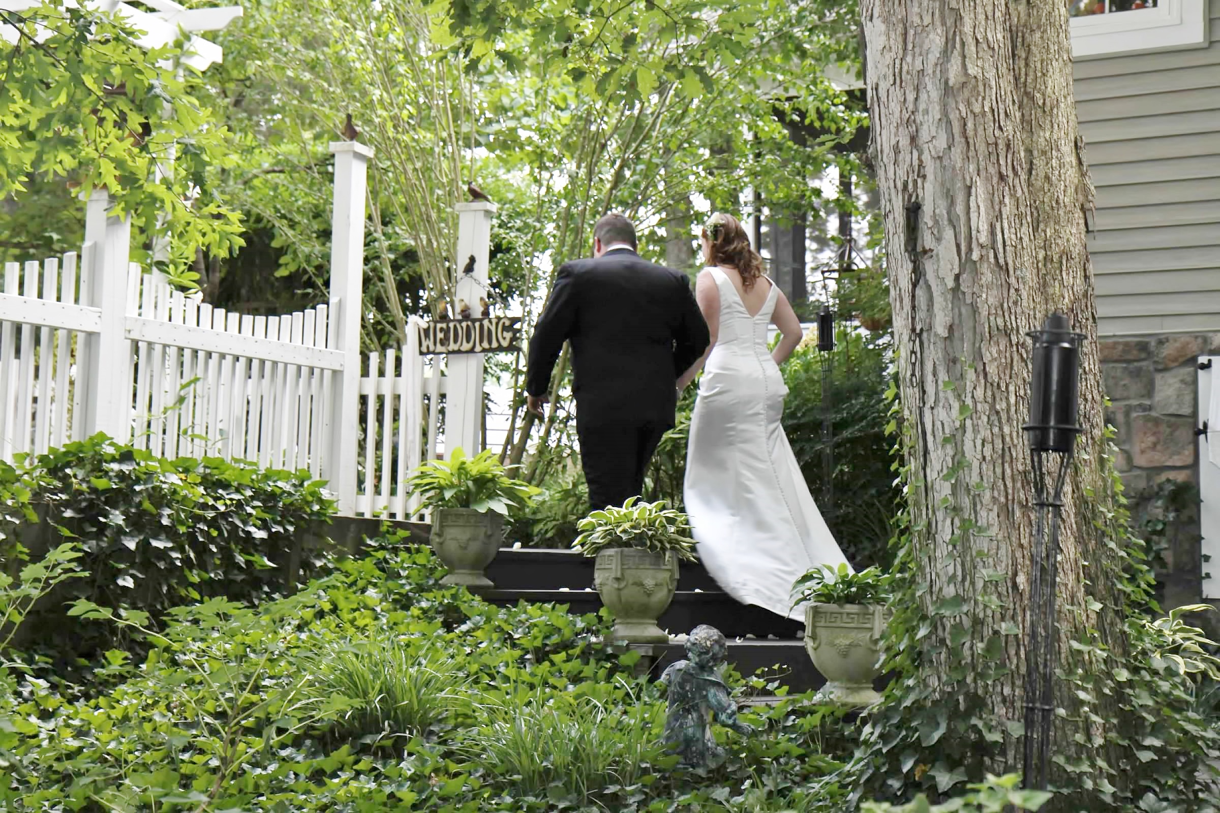 Bride and groom recessing up stairs.