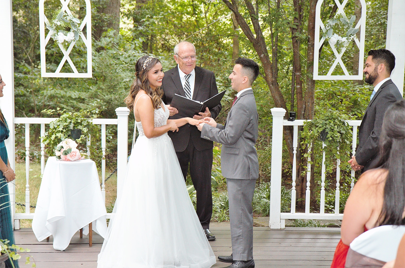 Bride and groom share a laugh during ceremony.