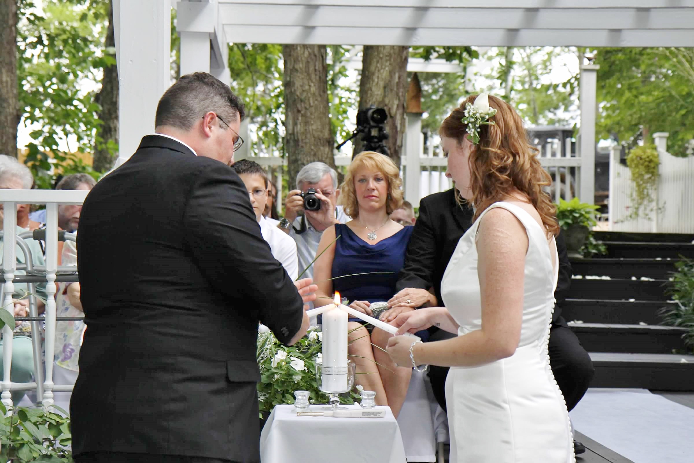 Bride and groom light the main candle together.