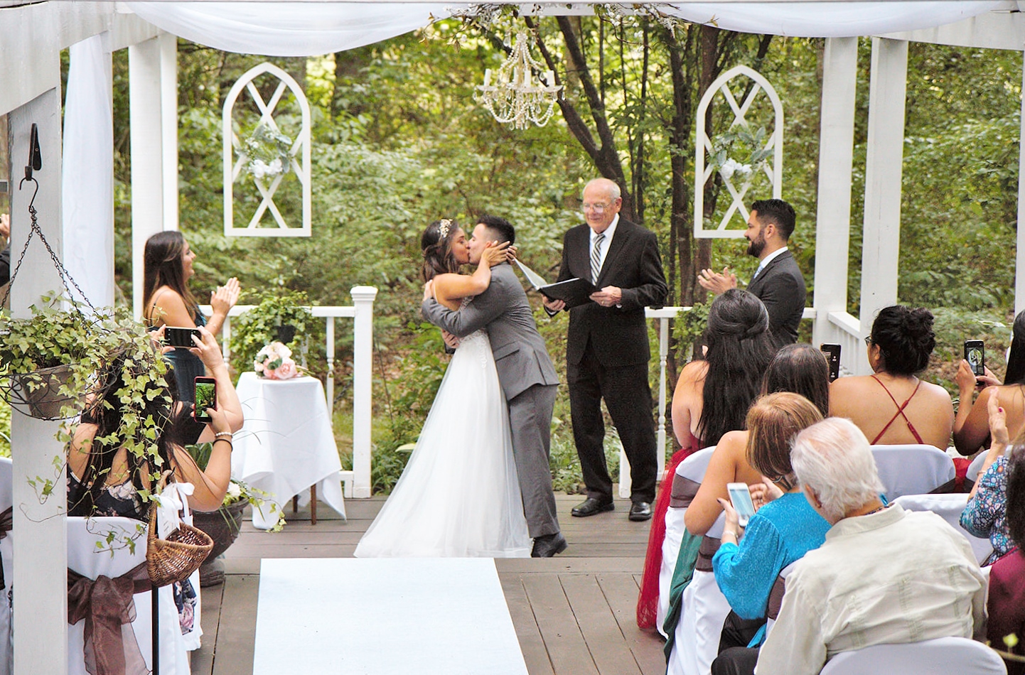 Bride and groom kiss first ceremony.