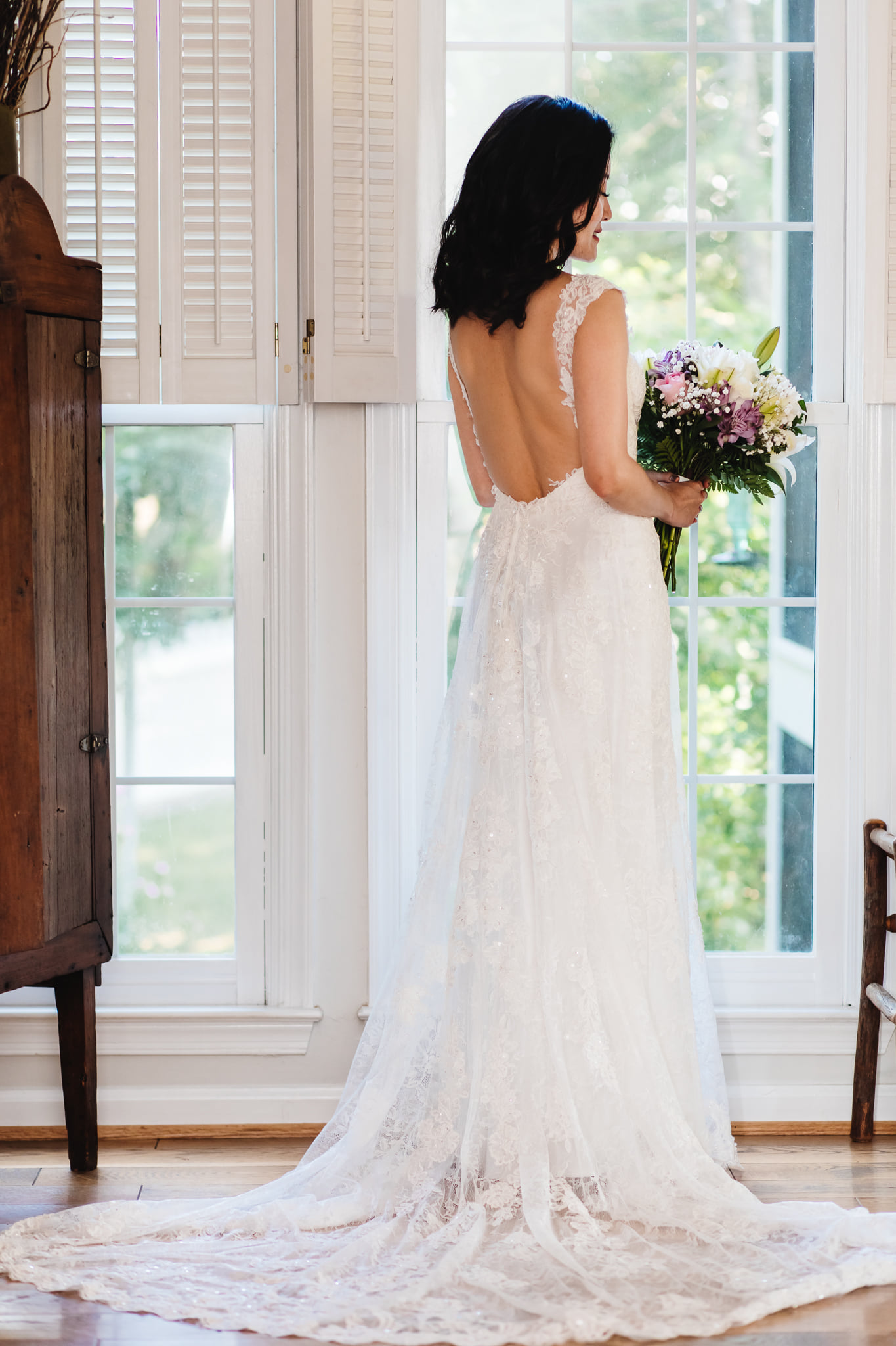 Bride posing in front of the window.